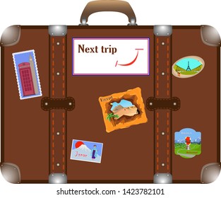 suitcase pasted over with stickers from different countries.