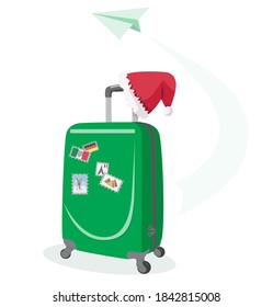 Suitcase with stamps from different countries. Santa Claus hat on a suitcase. Vacation for the New Year holidays. Concept