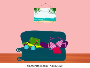 Suitcase with things for the sea lying on the wooden floor in the room. Collect suitcase in road travel.