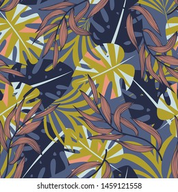 Summer abstract seamless pattern with colorful tropical leaves and plants on purple background. Vector design. Jungle print. Flowers background. Printing and textiles. Exotic tropics. Fresh design.