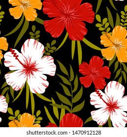 Summer abstract seamless pattern with tropical leaves and bright colors on a dark background. Jungle seal. Vector design. The background floral. Textiles and printing. Exotic, tropical.