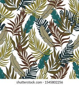 Summer abstract seamless tropical pattern in bright colors on white background. Exotic tropics. Summer. Seamless pattern with colorful leaves and plants. Tropic leaves in bright colors.
