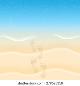 Summer background with beach sand and sea.Footprints in the sand