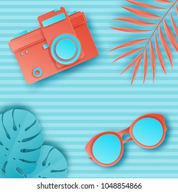 Summer background in pastel colors. Paper cut retro photo camera, tropical palm leaves and sunglasses on striped background. Summer vacation concept