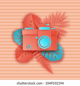 Summer background in pastel colors. Paper cut retro photo camera and tropical palm leaves on striped background. Summer vacation concept