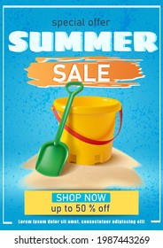 Summer background with sand yellow bucket and spade on blue background.