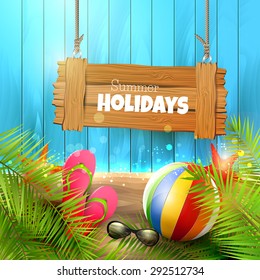 Summer background with with wooden sign,palm leaves, beach ball, sunglasses and flip-flops on wooden background