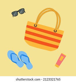 Summer bag, sunglasses, flip flops and suncream on sand. Good for vacation poster, beach party invitation, summer design