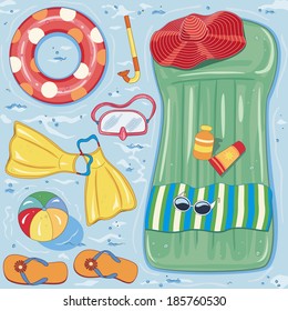 Summer beach accessories on blue water background