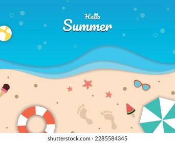 A summer beach card that consists of layers of paper in the form of water and sand, with various seasonal objects