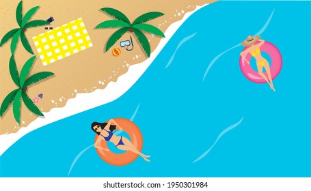 Summer beach design, people relaxing on a tubing in the sea, gorgeous summer vacation The view is high from the top. Summer for a beach vacation.