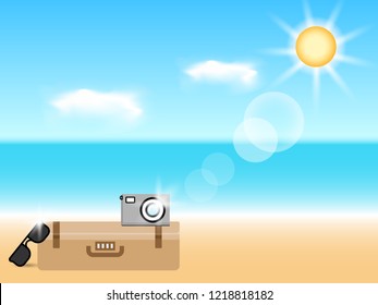 Summer beach holiday background. Clear sky at beach, luggage, pocket camera and sun glasses 