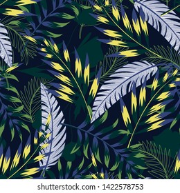 Summer bright original seamless pattern with tropical leaves and plants on a dark blue background. Vector design. Jung print. Floral background. Printing and textiles.