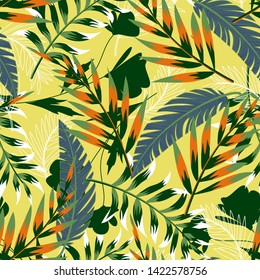 Summer bright original seamless pattern with tropical leaves and plants on a light yellow background. Vector design. Jung print. Floral background. Printing and textiles.