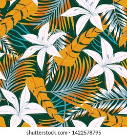 Summer bright seamless pattern with tropical leaves and flowers on green background. Vector design. Jung print. Floral background. Printing and textiles.