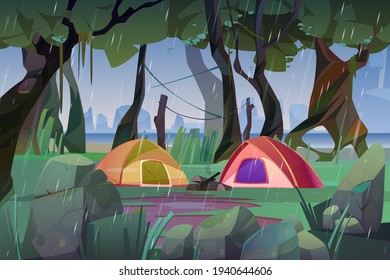 Summer camp with tents in forest at rainy weather