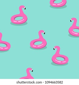 Summer colorful pattern. Inflatable pink flamingos floating in the pool