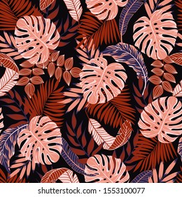 Summer colorful seamless pattern. Tropical leaves and plants on a dark background. Floral pattern, Jungle leaves. Exotic wallpaper, Hawaiian style. Vector background for various surface. 