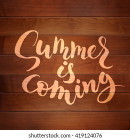 Summer is coming lettering on wood texture. 