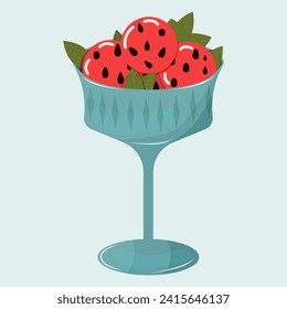 Postre veraniego de bolas de sandía con menta en una copa