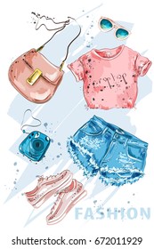 Summer Fashion outfit. Stylish trendy clothing: shorts, crop top, bag, shoes, sunglasses and photo-camera. Fashion girl clothes set, accessories. Woman's fashion look. Sketch. Vector illustration.