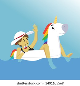 Summer girl on vacation riding inflatable unicorn balloon in a pool while drinking