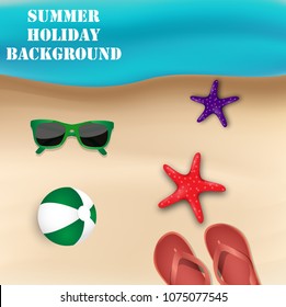 Summer Holiday background. Top view on beach ball, flipflop, starfish and sunglasses in the beach sandy 