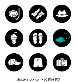 Summer holidays glyph icons set. Aqualung, flippers, homburg hat, refreshing drink, flip flops, fishing, cap, shorts, photo camera. Vector white silhouettes illustrations in black circles