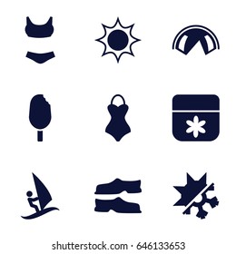 Summer icons set. set of 9 summer filled icons such as flower, slippers, cold and hote mode, ice cream, swimsuit, surfing, tent, sun