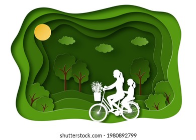 Summer landscape background in paper cut style. Mom and daughter ride a bike on a green nature background. Vector illustration.