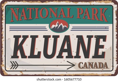 Summer landscape in canadian Kluane national park rusted metal sign