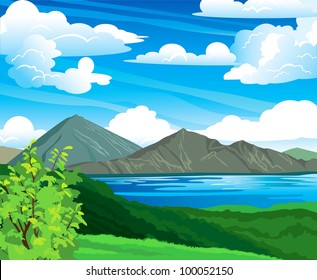 Summer landscape with volcano Batur, green forest and blue lake on a cloudy sky. Indonesia, Bali.