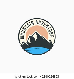 Summer mountain lake logo design. Mountain travel badge concept. Simple mountain outdoor activity emblem concept.