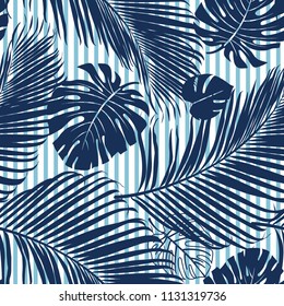 Summer Navy blue tropical forest leaves bright mood on sky blue stripe seamless pattern for fashoin fabric, wallpaper and card.