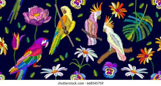 Summer night colors palette. Seamless vector pattern with parrots, cockatoos, flowers and palm leaves on black background. Stylized embroidered texture. Vintage motifs.