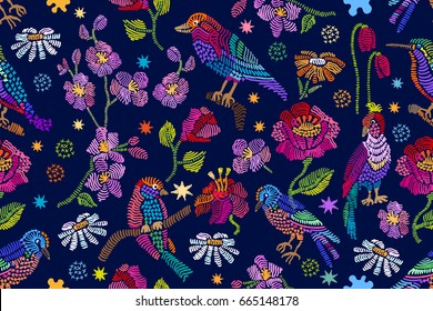 Summer night garden. Vintage birds, chamomiles, poppies and tulips on dark blue background. Stylized embroidered texture. Folk art textile collection.