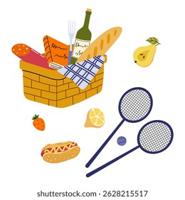 Summer picnic basket with food, drinks, and sporting equipment outdoors