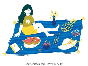 Summer picnic with watermelon, fruits and a book. Girl is sitting on a blue blanket.