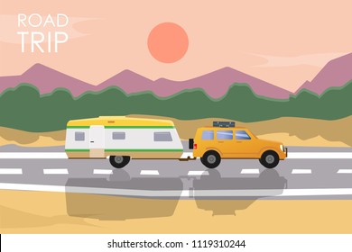 Summer road trip concept. Yellow car with a camper trailer riding on the road at sunset.