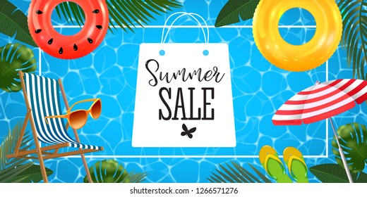 Summer sale banner with realistic inflatable rings, chaise lounge, sun glasses, beach umbrella and slates and tropical leaves background, exotic floral design.
