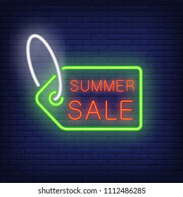 Summer sale text on tag in neon style. Green sale tag with red text on dark brick wall. Night bright advertisement. Vector illustration in neon style for shopping and advertisement