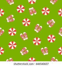 Summer seamless pattern with flip-flops and umbrellas