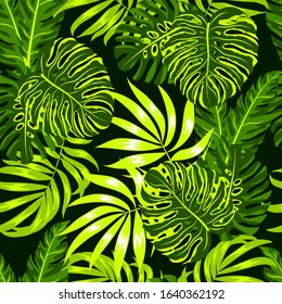 Summer seamless pattern with green and yellow tropical plants on a dark background. Trendy summer Hawaii print.  Floral pattern. Hand draw texture. Vector template. Jungle leaves.