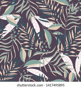 Summer seamless pattern with tropical leaves and plants on a dark background. Vector design. Jungle print. Textiles and printing. Floral background.