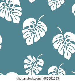 Summer seamless pattern with white monstera palm leaves on blue background, vector illustration