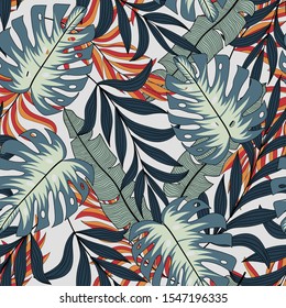Summer seamless tropical pattern with bright red and green plants and leaves on a light background.  Vector design. Jungle print. Floral background. 