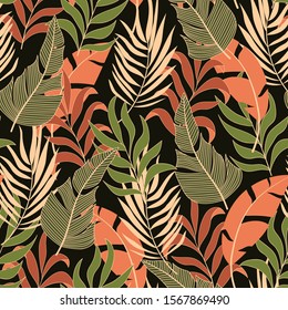 Summer seamless tropical pattern with bright red and green plants and leaves on a black background. Jungle leaf seamless vector floral pattern background. 
Tropic leaves in bright colors.