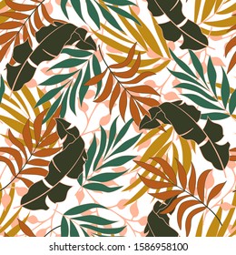 Summer seamless tropical pattern with bright orange and yellow plants and leaves on a delicate background. Beautiful seamless vector floral pattern. Exotic jungle wallpaper.