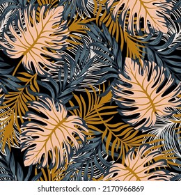 Summer seamless tropical pattern with bright plants and leaves on a black background. Seamless exotic pattern with tropical plants. Exotic wallpaper.