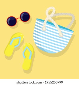 Summer set of beach elements. Flip flops, beach bag, sunglasses